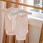 BEBE PINK POINTELLE BODYSUIT